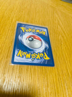 Machop Base Set 1.ª edición española, reverso de la carta fotografiada