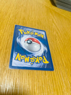 Poliwag Base Set 1.ª edición española, reverso de la carta fotografiada