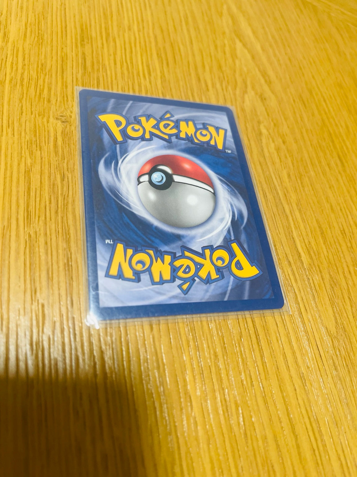 Poliwhirl Base Set 1.ª edición española, reverso de la carta fotografiada